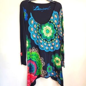Desigual large peacok floral colorful top. Shark bite hem.